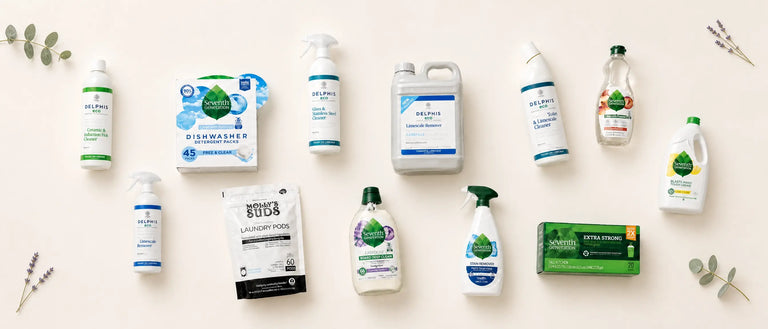 Flat lay of Delphis Eco and Seventh Generation eco-friendly cleaning products on cream background